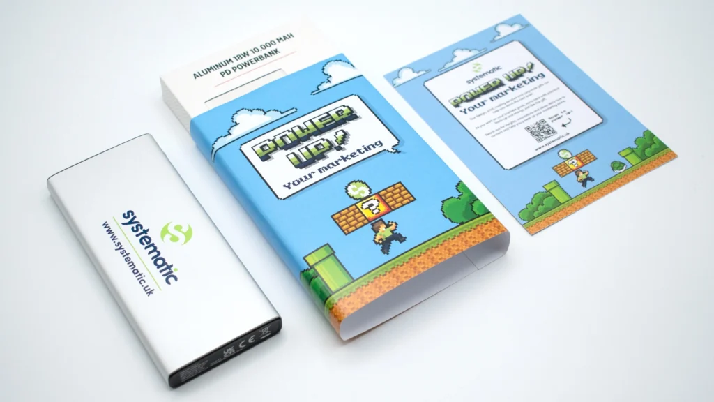 An image of Systematic's marketing campaign, showing a power bank, the box design and the two sided card with 'Power up your marketing' text