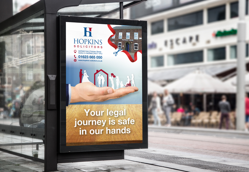 Hopkins Solicitors advert on bus shelter