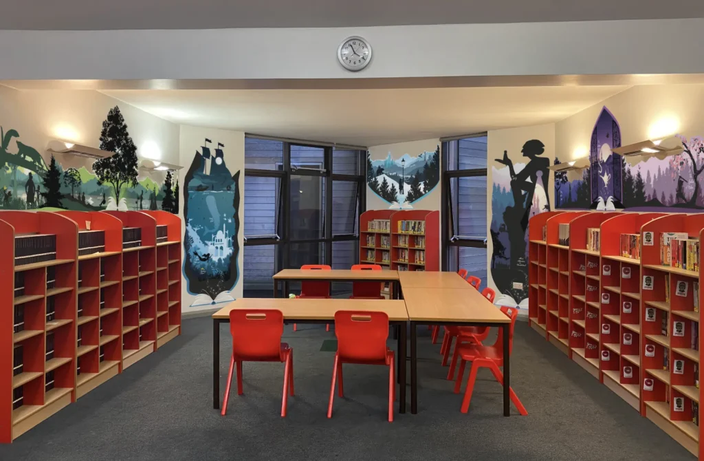 A photograph of the Star Academies library with illustrative signage designed by oodle Agency