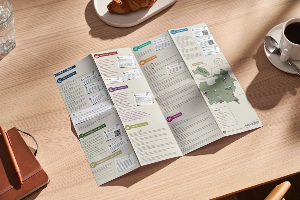 A photograph showing the hidden gems brochure folded out for West Lindsey District Council designed by oodle Agency