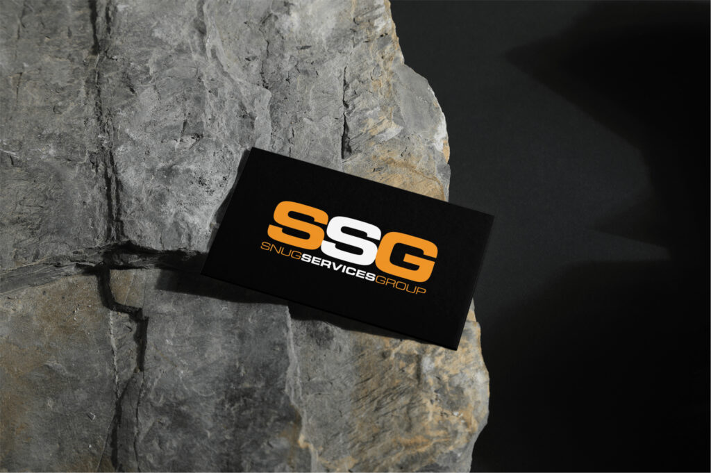 A graphic of Snug Services Group business card with a rocky background